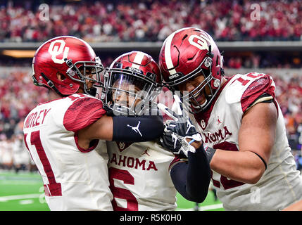 Oklahoma cornerback Tre Brown (6) celebrates with teammates Oklahoma cornerback Parnell Motley (11) and Oklahoma defensive end Amani Bledsoe (72) after he gets a sack in the end zone for 2-points during the Dr. Pepper Big-12 Championship between the Oklahoma Sooners vs Texas Longhorns at an NCAA Big-12 Championship Football game at the AT&T Stadium, Arlington Texas. 12/01/18.Manny Flores/Cal Sport Media Stock Photo