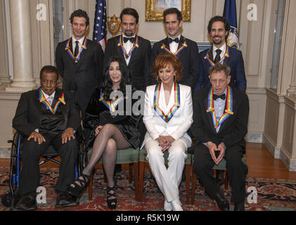 Reba McEntire left and Lin Manuel Miranda right two of the recipients of the 41st Annual Kennedy Center Honors converse prior to posing for a group photo following a dinner hosted by United