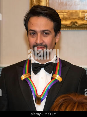 Washington DC, USA. 1st XDecember, 2018. Lin-Manuel Miranda, one of the special honorees for Groundbreaking Work on Hamilton, as he poses with the recipients of the 41st Annual Kennedy Center Honors pose for a group photo following a dinner hosted by United States Deputy Secretary of State John J. Sullivan in their honor at the US Department of State in Washington, DC on Saturday, December 1, 2018. The 2018 honorees are: singer and actress Cher; composer and pianist Philip Glass; Country music entertainer Reba McEntire; and jazz saxophonist and composer Wayne Shorter. Credit: MediaPunch Inc/Al Stock Photo