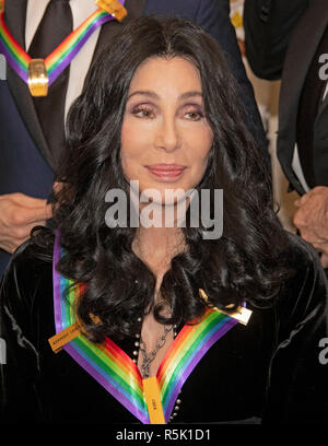Washington DC, USA. 1st XDecember, 2018. Cher, one of the recipients of the 41st Annual Kennedy Center Honors as she poses for a group photo following a dinner hosted by United States Deputy Secretary of State John J. Sullivan in their honor at the US Department of State in Washington, DC on Saturday, December 1, 2018. The 2018 honorees are: singer and actress Cher; composer and pianist Philip Glass; Country music entertainer Reba McEntire; and jazz saxophonist and composer Wayne Shorter. Credit: MediaPunch Inc/Alamy Live News Stock Photo