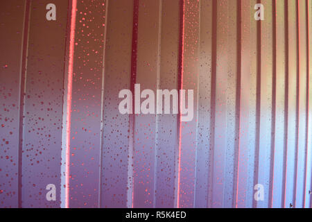 metal profile. Diagonal pattern of metal profile. Fences from the galvanized iron painted by a polymeric covering. Stock Photo