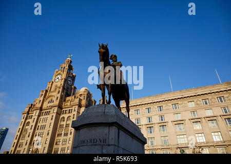 Liverpool Waterfront The Port Liver Building frames the The Three Graces  Equestrian statue of King Edward VII Stock Photo