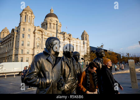 Liverpool Waterfront Liverpool's most famous sons the Fab Four  Beatles musicians bronze statue at Pier Head by Sculptor Andy Edwards Stock Photo