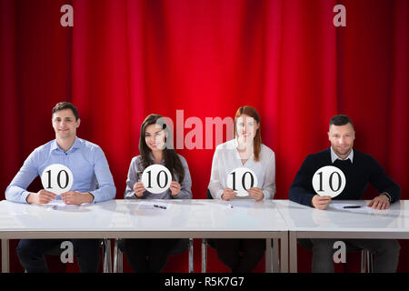 Panel Judges Holding 10 Score Signs Stock Photo