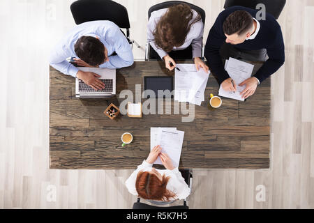 Job Applicants Having Interview Stock Photo