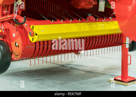 Corn harvester head with several silver blades. Agricultural machinery for soil cultivation Stock Photo