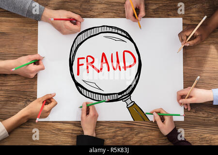 People Drawing Fraud Investigation And Audit Concept In Notepad Stock ...