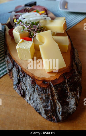 wooden board with bread,cheese,butter and sausage Stock Photo