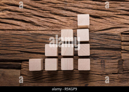 Increasing Bar Graph Blocks On Wood Stock Photo