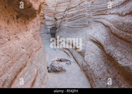 Passage through a slot canyon showing wavy patterns of erosion at Kasha-Katuwe Tent Rocks National Monument Stock Photo