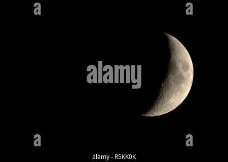 Waxing crescent moon seen with telescope Stock Photo