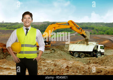 Asian engineer wearing safety vest Stock Photo
