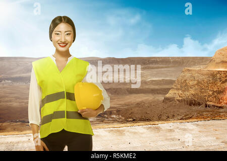 Asian engineer wearing safety vest Stock Photo