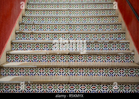 Inlaid tiled staircase in the traditional Spanish style in a home in the Andalusian city of Ronda in southern Spain Stock Photo