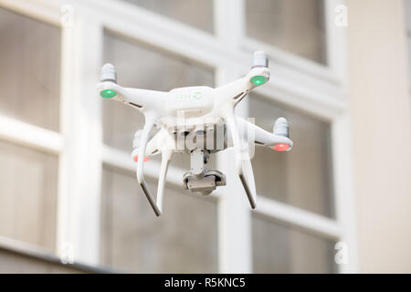 Drone spying through house window Stock Photo