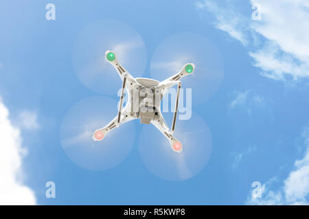 Drone flying against clear blue sky Stock Photo