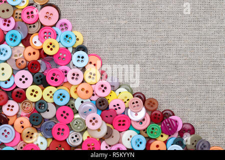colorful buttons for sewing and craft on fabric background Stock Photo