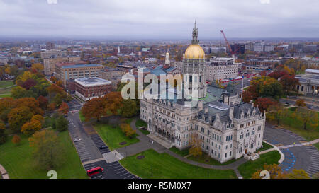 An aerial view focusing on the Connecticut State House with blazing fall color in the trees around Hartford Stock Photo