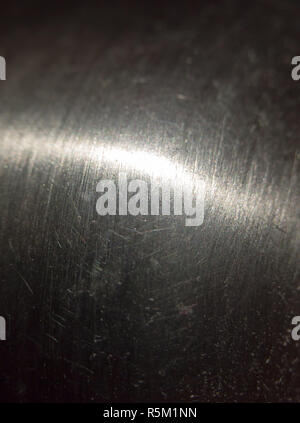 close up scratched metal surface with light across Stock Photo