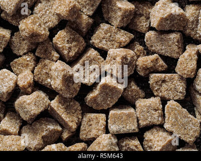 Rushy raw sugar cubes close up Stock Photo