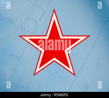 Five-pointed red star on the wing skin of a military fighter Stock Photo