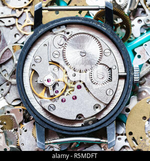 clockwork on heap of clock spare parts Stock Photo