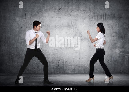 Business man and woman fighting Stock Photo