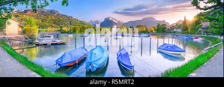 Boats docked on the shores of Lake Walensee Stock Photo