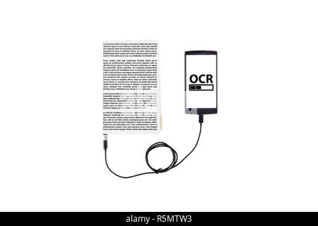 Book connected to a smartphone through an USB cable. Optical character recognition loading bar. Stock Photo