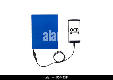 Book connected to a smartphone through an USB cable. Optical character recognition loading bar. Stock Photo