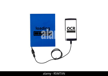 Book connected to a smartphone through an USB cable. Optical character recognition loading bar. Stock Photo