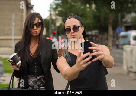 Young couple taking selfies Stock Photo