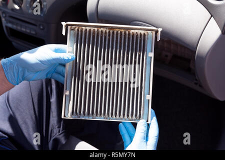 Replacing the old cabin air filter Stock Photo - Alamy