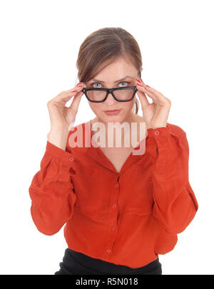 Woman looking over her glasses Stock Photo