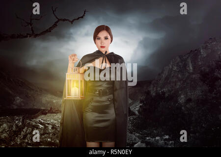 Asian witch woman with a lantern Stock Photo