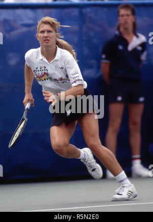 Steffi Graf chasing down a shot during a match at the 1989 US Open at Flushing Meadow. Stock Photo