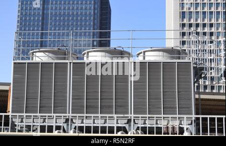 Cooling tower HVAC services on a building rooftop in Tokyo Stock Photo