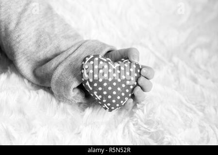baby hand with heart Stock Photo