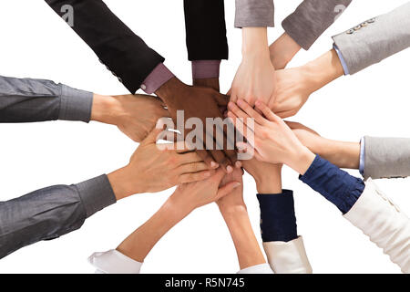 Togetherness message from small hands for 8 March, International Women's  Day. Small hands stacked on top of each other Stock Photo - Alamy