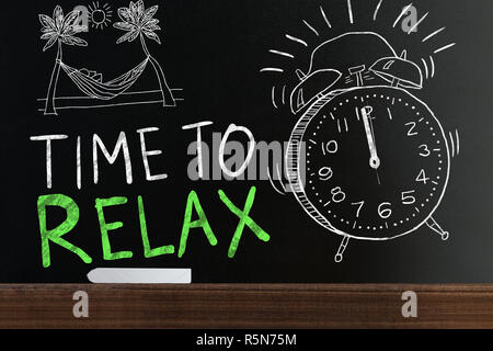 Time To Relax Words On Blackboard Stock Photo