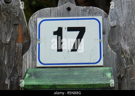 Vintage metal house number on the wall Stock Photo