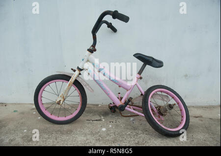 A broken rear wheel kid bicycle Stock Photo