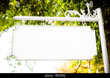 Blank white vintage metal hanging signboard with copy space Stock Photo