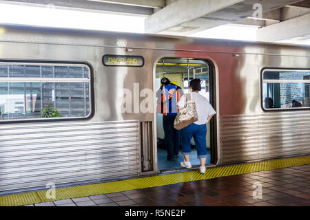 Miami Florida,Metrorail,mass transit,station,passenger passengers rider riders,boarding,train,man men male,woman female women,FL090930001 Stock Photo