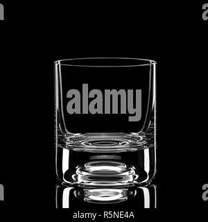 Transparent empty glass of whiskey isolated on black background Stock Photo