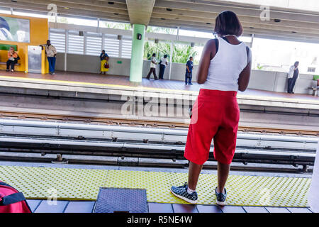 Miami Florida,Civic Center Metrorail Station,mass transit,public transportation,platform,edge,rail track,Black Blacks African Africans ethnic minority Stock Photo