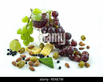 Wine, grapes and food isolated on white background Stock Photo
