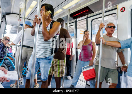 Miami Florida,Metromover,public transportation,mass transit,automated people mover,passenger passengers rider riders,Black Blacks African Africans eth Stock Photo