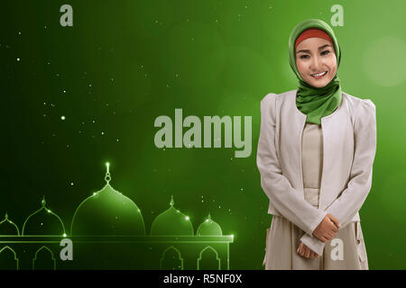 Young asian muslim woman give smile Stock Photo