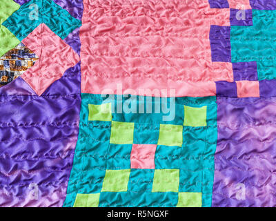 square pieces of fabrics in stitched patchwork Stock Photo